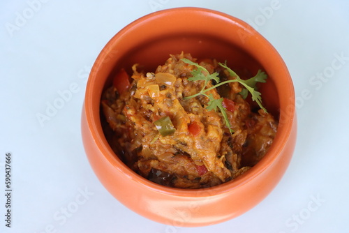 Baigan Bharta or Vangyache Bharit, a roasted and mashed eggplant fry or curry, favourite maharashtrian curry, served in a bowl, Indian traditional food photo