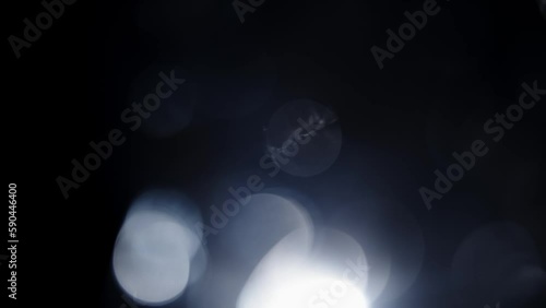 Mystical and Enchanting Blurred Bokeh of Glimmering Natural Foliage on Dark, Mysterious Backdrop