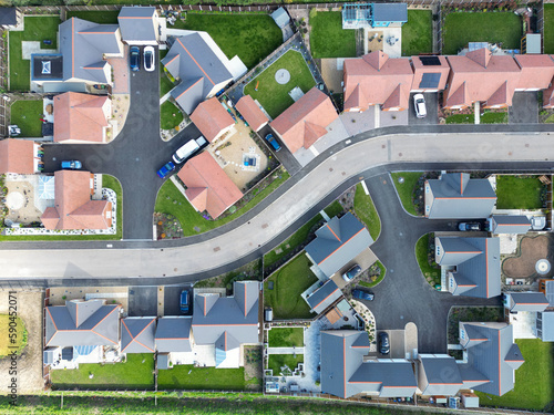 Drone top down view of detached bungalows seen at a new housing development in the English countryside. photo