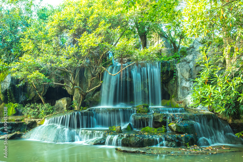 long  exposure  of waterfall flowing in forest garden