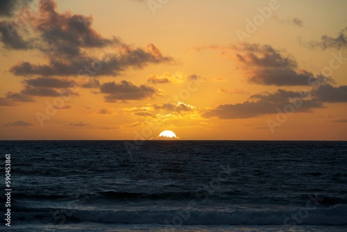Fototapeta Naklejka Na Ścianę i Meble -  Beautiful golden sunset over the sea.
