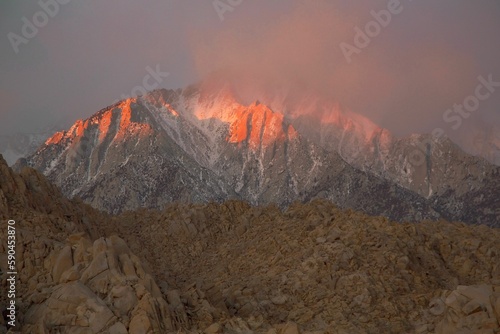 Scenic shot of Sierra Nevada mountain st pinky sunset with fog in California