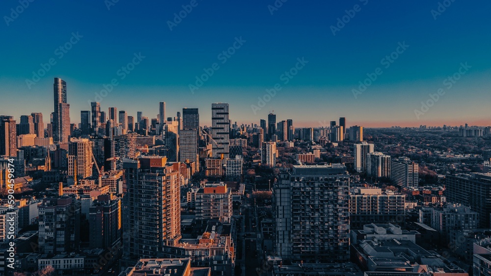 Aerial view of the beautiful buildings of Toronto during a golden sunset