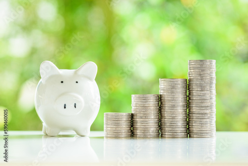 Принти на полотні A cheerful piggybank with stacks of shiny coins nearby, representing smart savings strategies