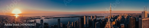 Photography Aerial view of the beautiful buildings of Toronto during a golden sunset