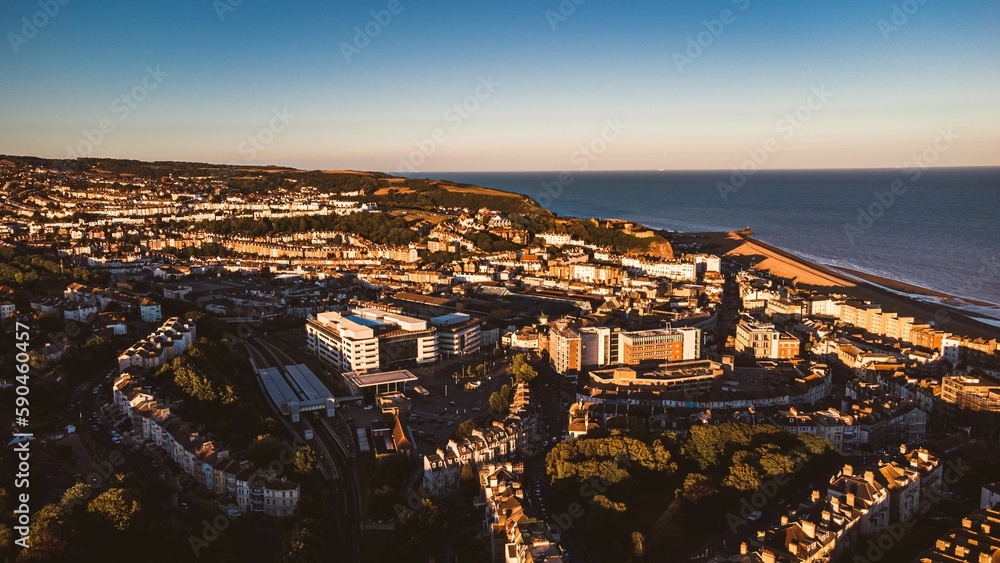 Aerial view of a unique tropical town and the sea in England at sunset