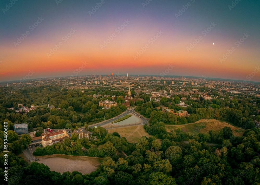 Landscape view of the he Hampstead with multiple buildings and parks at sunset