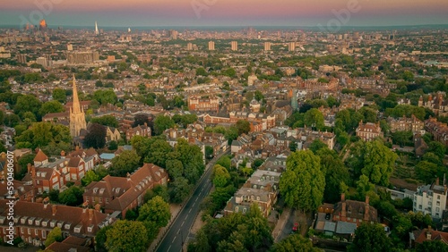 Aerial view of the Whitestone Walk  Hampstead with tall buildings and trees at sunset