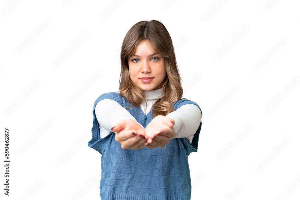 Young girl over isolated chroma key background holding copyspace imaginary on the palm to insert an ad Young girl over isolated chroma key background holding copyspace imaginary on the palm to insert an ad