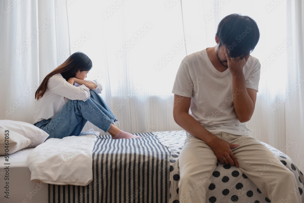 The husband is unhappy and disappointed in the erectile dysfunction during sex while his wife sleeping on the bed. Sexual Problems in Men, The concept of erectile dysfunction according. The husband is unhappy and disappointed in the erectile dysfunction during sex while his wife sleeping on the bed. Sexual Problems in Men, The concept of erectile dysfunction according.