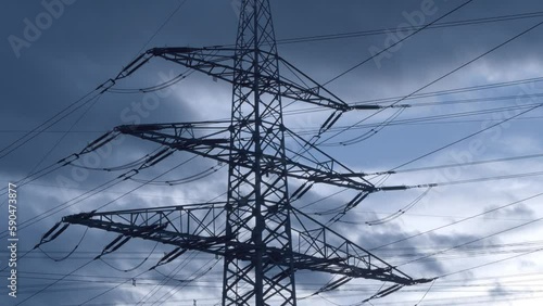 Beautiful fluffy clouds in the blue sky above powerlines during daytime photo