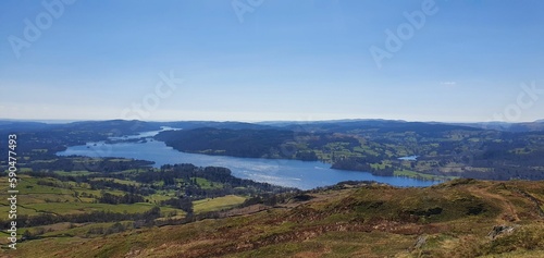 Panoramic of a beautiful landscape with hills and river under the blue sky