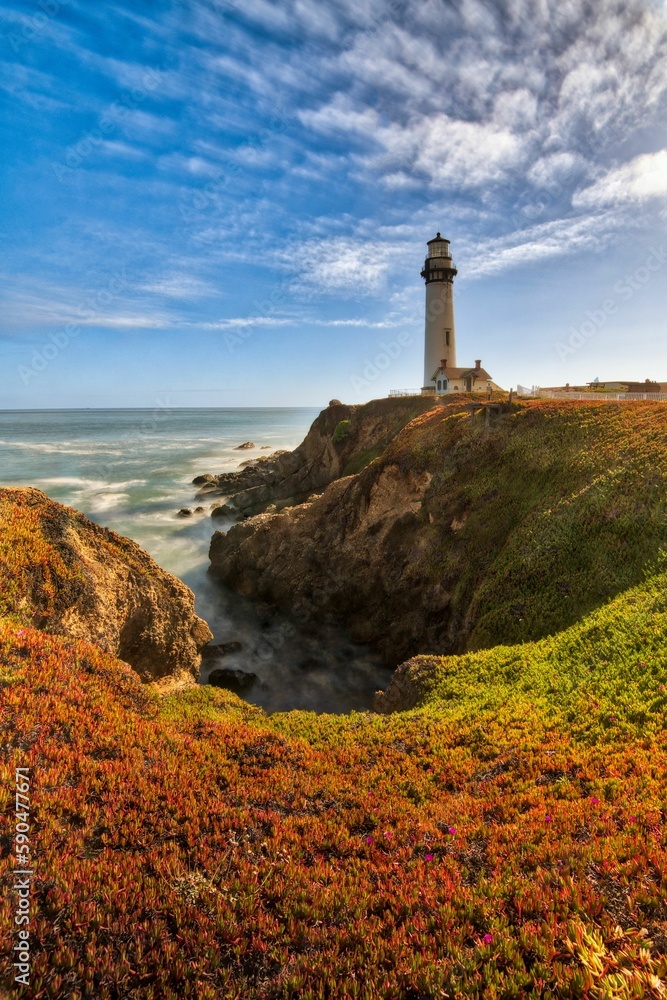 Vertical shot of a beautiful lighthouse near the sea