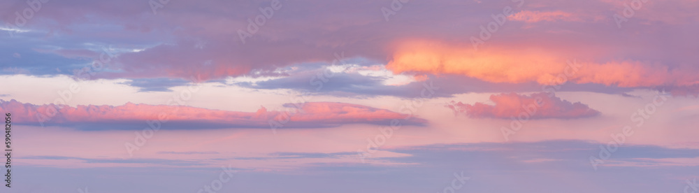 Beautiful panoramic sky with glowing clouds at sunset
