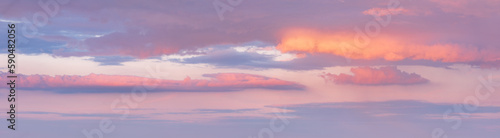 Beautiful panoramic sky with glowing clouds at sunset © AVTG