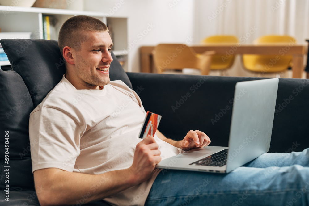 A Caucasian man is contactless shopping online A Caucasian man is contactless shopping online