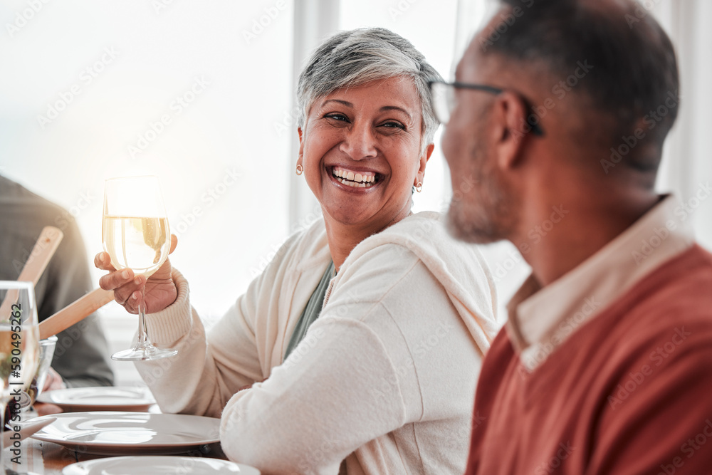 Happy, smile and couple at lunch in family home, drinking wine and laughing at jokes. Conversation, together and a man and woman speaking with a drink during a dinner with friends in a house Happy, smile and couple at lunch in family home, drinking wine and laughing at jokes. Conversation, together and a man and woman speaking with a drink during a dinner with friends in a house