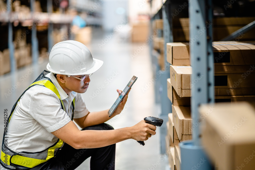 Warehouse workers use scanner checking and scan the barcode of stock inventory to keep storage in a system, Smart warehouse management system, Supply chain and logistic network technology concept. Warehouse workers use scanner checking and scan the barcode of stock inventory to keep storage in a system, Smart warehouse management system, Supply chain and logistic network technology concept.