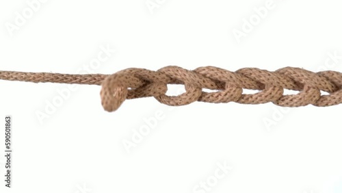 Untangling uncoupling knitted loops close up slow motion.
