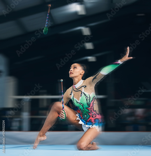 Woman  gymnast and dance sticks with balance and focus in a gym for dancing performance art. Exercise  training and sports competition of an athlete with moving for show for fitness and dancer sport