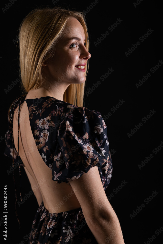 portrait of a beautiful blonde woman on a black background portrait of a beautiful blonde woman on a black background