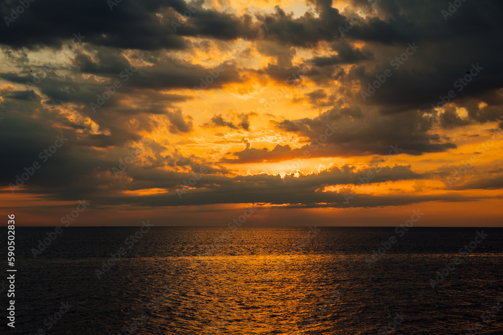 calm beautiful sea at sunset sky in the clouds walk