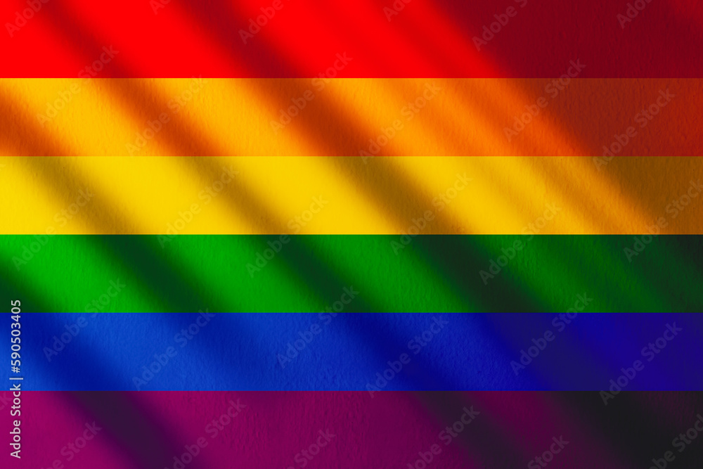 Fototapeta premium The gay pride rainbow flag with shadows and copy space. Gay pride movement.