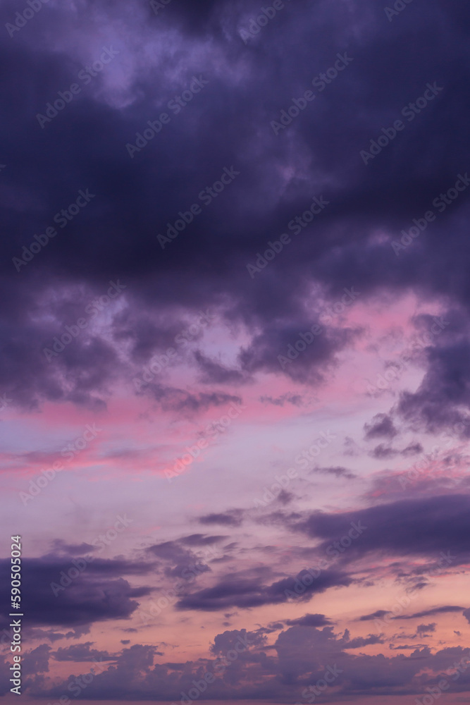 Epic dramatic sunrise, sunset pink violet blue sky with dark storm clouds background texture