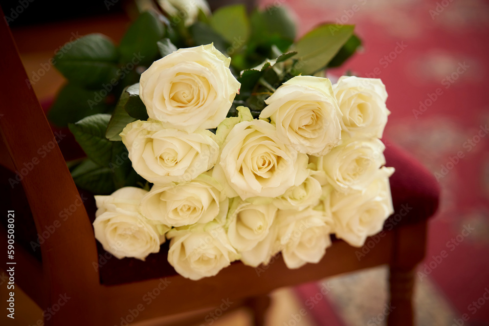 Fototapeta premium wedding bouquet of white roses. White roses Flower composition. Luxury bouquet of fresh roses. Beautiful white wedding bouquet.