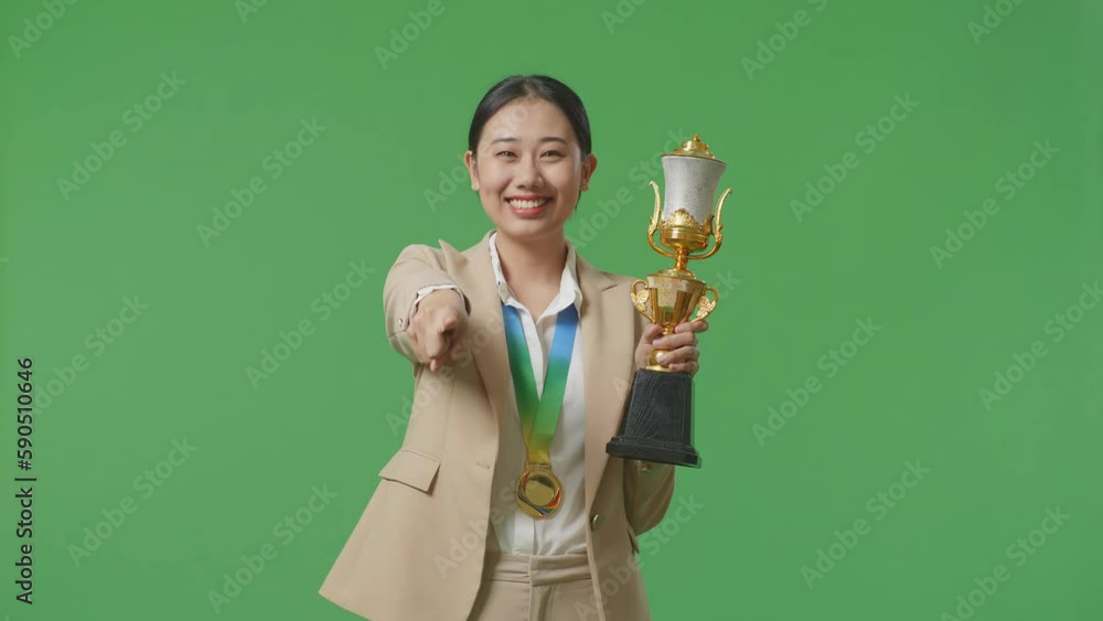 Asian Business Woman In A Suit With A Gold Medal And Trophy Touching ...