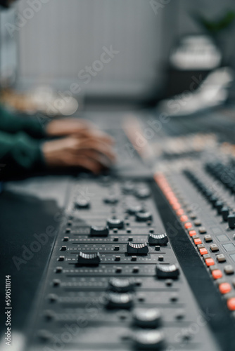 Sound engineer used digital audio mixer Sliders Engineer presses keys Control panel Recording studio technician