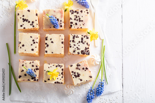 Tasty coconut cake made whiote chocolate and butter. photo