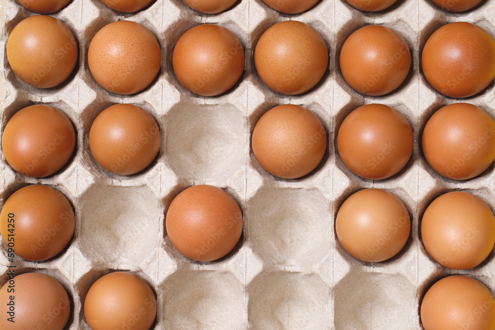 Top view of eggs in a cardboard box ready for breakfast Top view of eggs in a cardboard box ready for breakfast