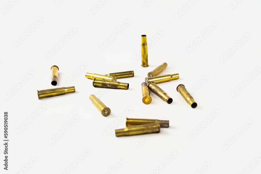assault rifle cartridges and bullets in a pile of ammo on a white background assault rifle cartridges and bullets in a pile of ammo on a white background