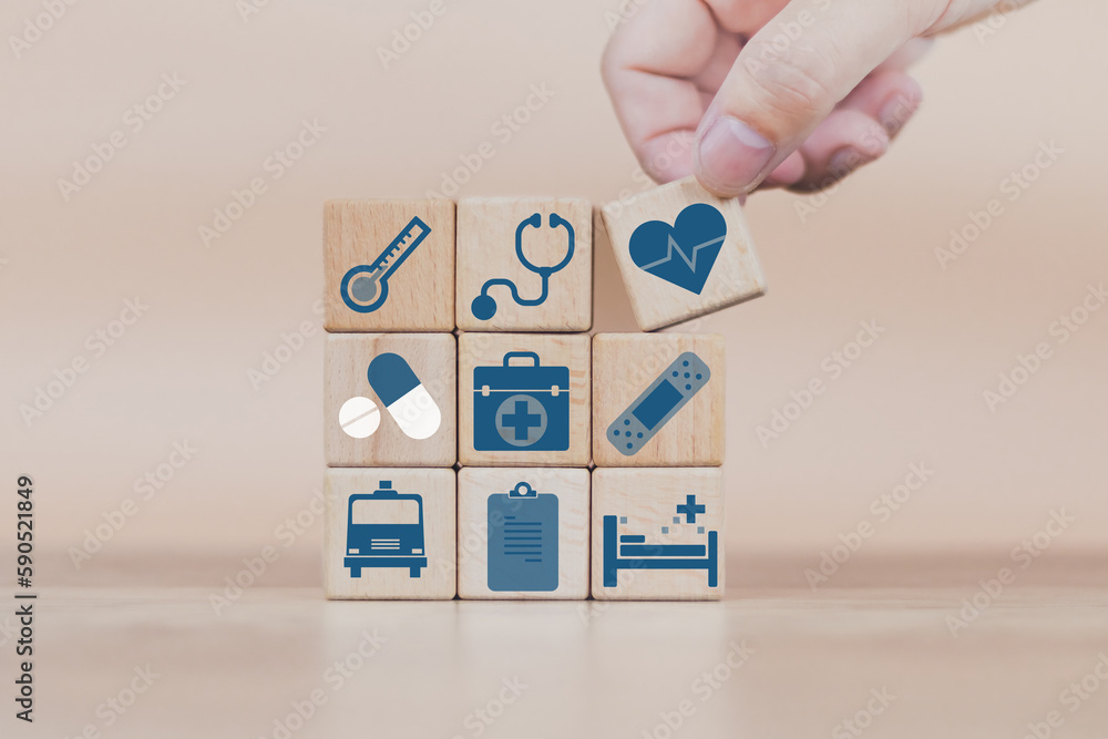 business man doing a row wood cube block  with healthcare medical to plan buy insurance wellnes life comprehensive  hospital drug pharmacy ambulance including family money investment retirement - obrazy, fototapety, plakaty 