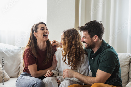 Beautiful family of three having a laugh together.