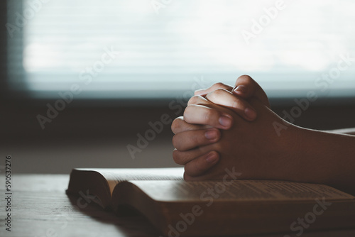 Young woman person hand praying on holy bible with study. Adult female christian reading book in church. Girl learning religion spirituality with pray to god. concept of student education faith.