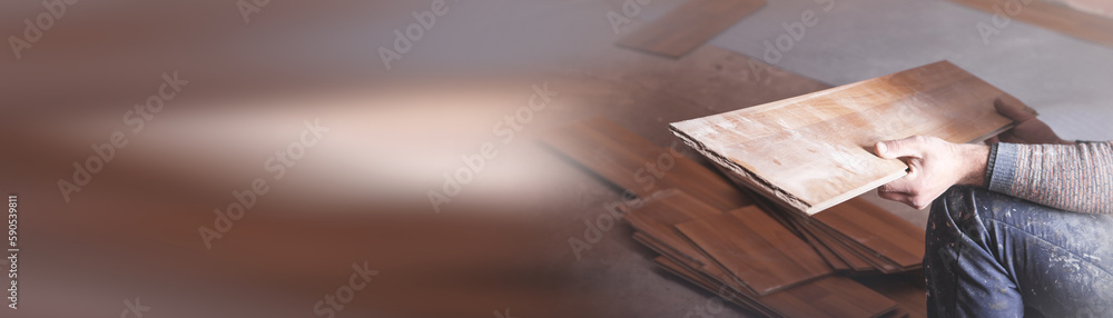 Worker installing new laminate wooden floor. Worker installing new laminate wooden floor.