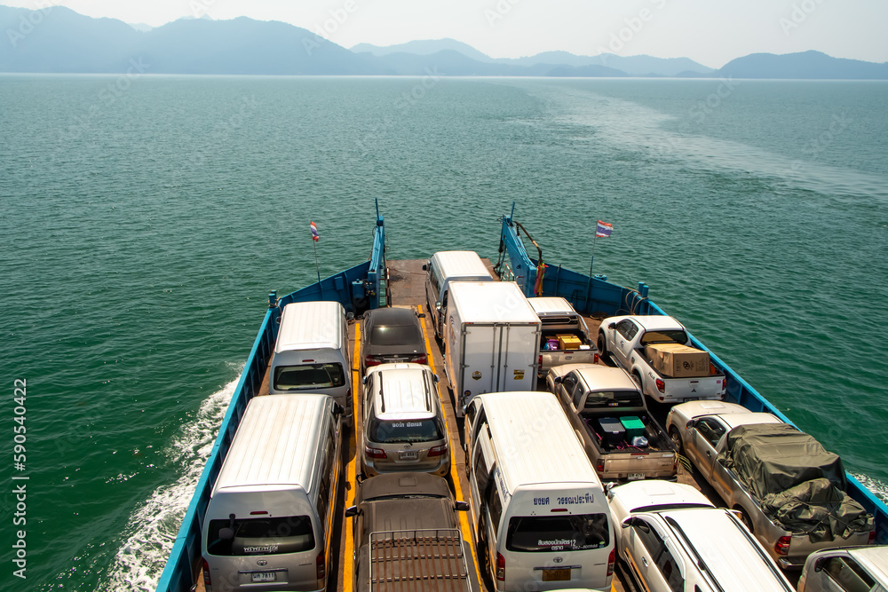 Naklejka premium Thai ferry boat with cars on deck at sea to Koh Chiang Thailand