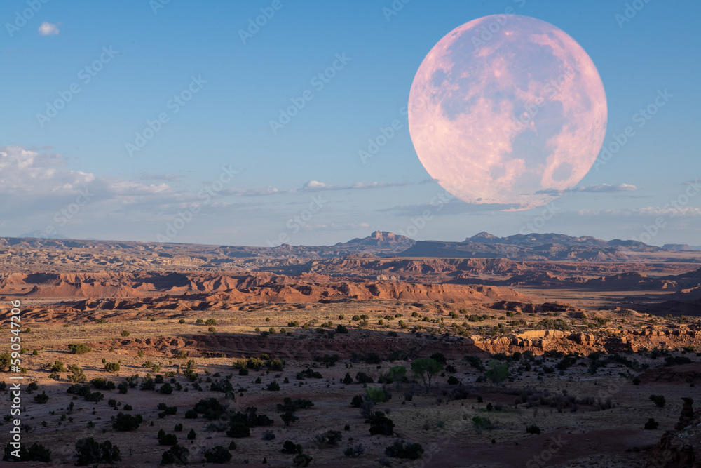 Giant moon over valley