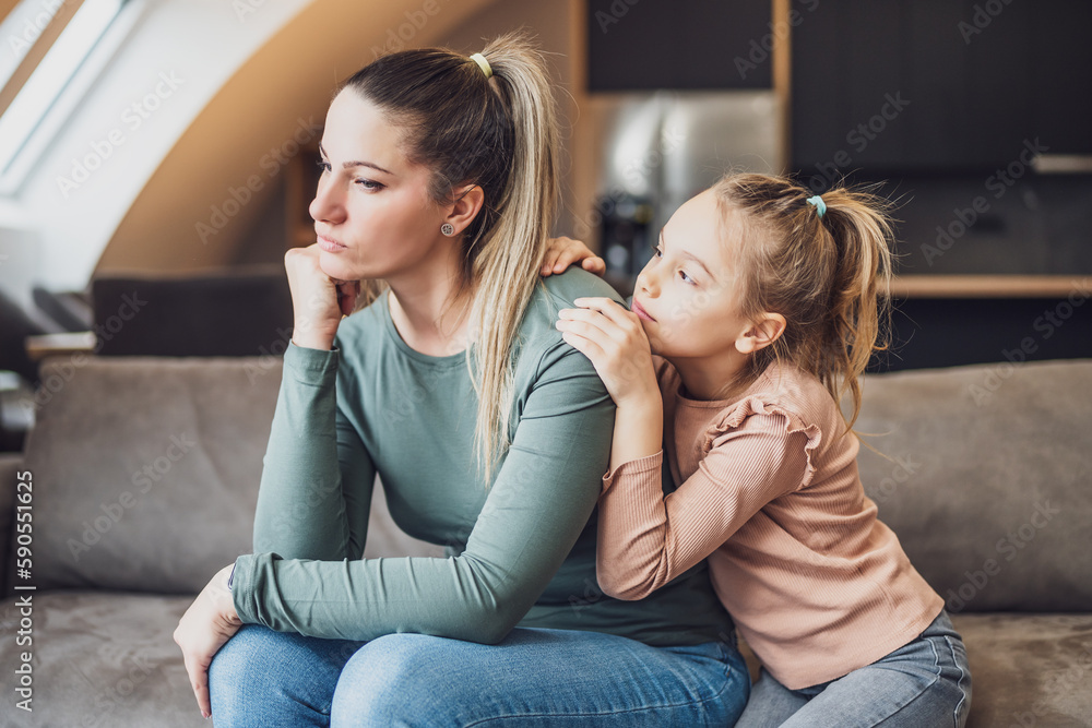 Daughter is trying to comfort her mother after their conflict. Daughter is trying to comfort her mother after their conflict.