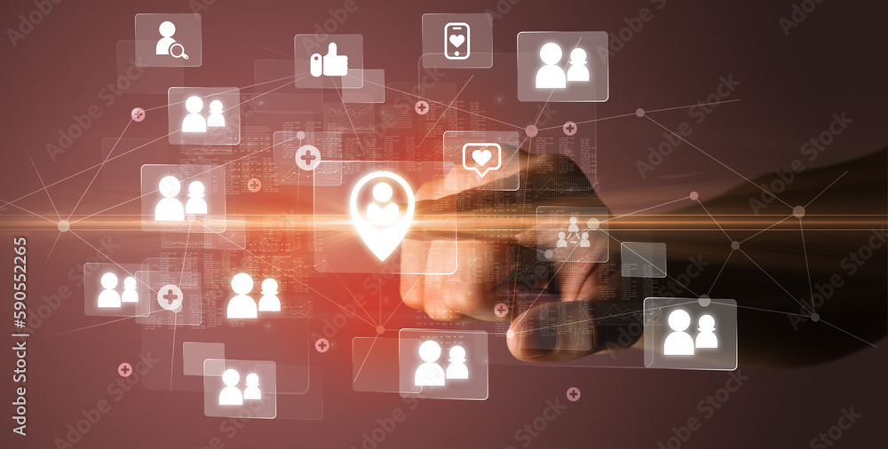 Hand pressing social media multimedia application screen with media icons on futuristic concept Hand pressing social media multimedia application screen with media icons on futuristic concept
