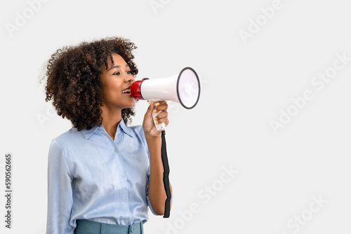 business woman shouting loud holding a megaphone, expressing success and positive concept, idea for marketing or sales photo