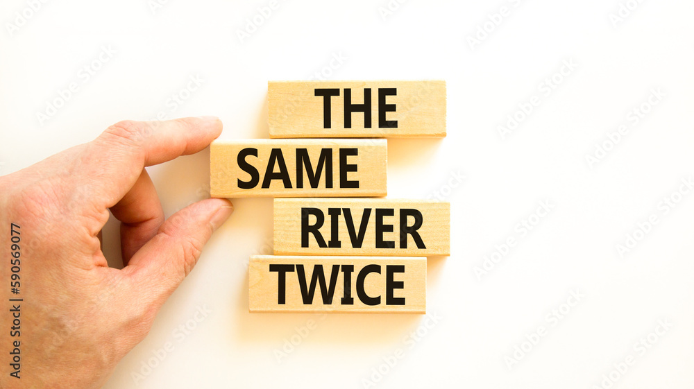 The same river twice symbol. Concept words The same river twice on wooden block. Beautiful white table white background. Motivational business the same river twice concept. Copy space. The same river twice symbol. Concept words The same river twice on wooden block. Beautiful white table white background. Motivational business the same river twice concept. Copy space.