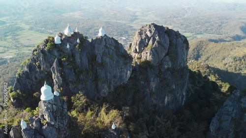 Fly up over Temple at cliff on top of Mountain, wat chaloem lampang Chiang mai photo