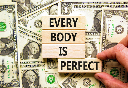Every body is perfect symbol. Concept words Every body is perfect on wooden block. Beautiful background from dollar bills. Motivational business every body is perfect concept. Copy space.