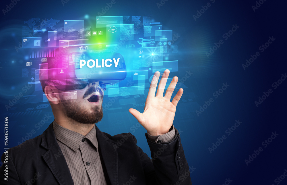 Obraz premium Businessman looking through Virtual Reality glasses