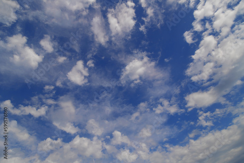Beautiful blue sky with white Altocumulus undulatus clouds.