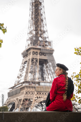 Blonde girl in fron of Eiffel Tower