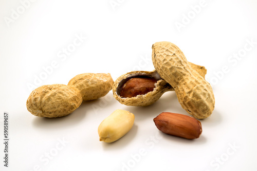Dried peanuts in closeup on white background